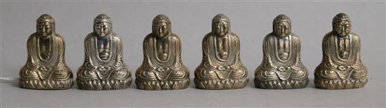 A set of six novelty sterling silver condiments, each modelled as a seated Buddha, 38mm.